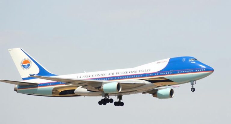 an air force one airplane painted in red white and bl